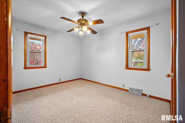 carpeted empty room with ceiling fan