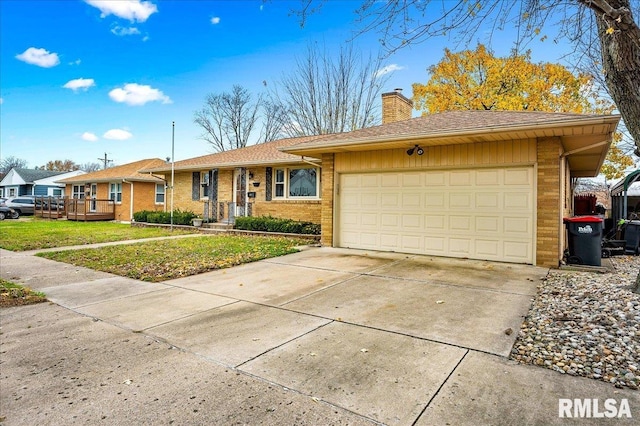 single story home with a front yard and a garage