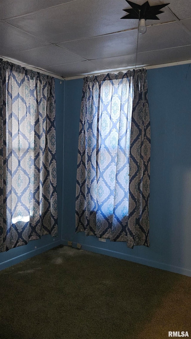 carpeted spare room with crown molding and ceiling fan