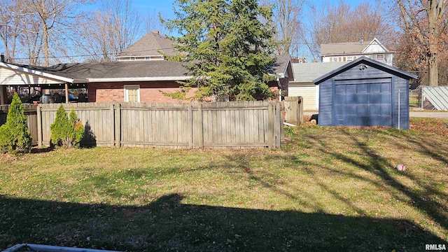 view of yard with an outdoor structure and a garage