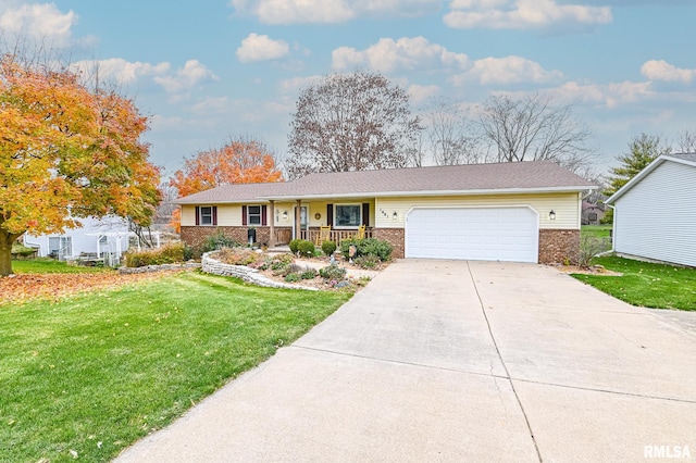 ranch-style home with covered porch, a front yard, and a garage