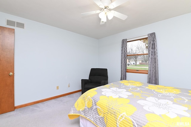 bedroom featuring ceiling fan and light carpet