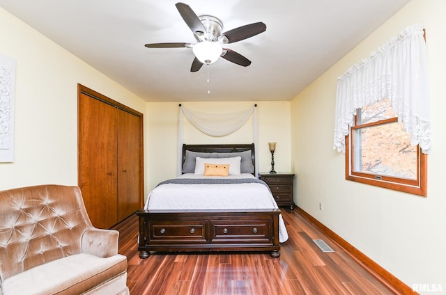 bedroom featuring a closet, ceiling fan, and dark wood-type flooring