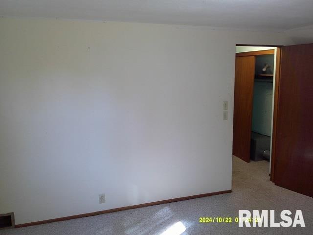 empty room with light colored carpet