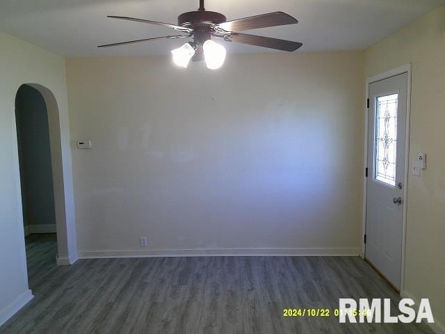 interior space featuring ceiling fan and dark wood-type flooring