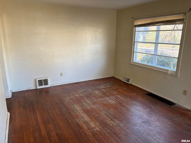 unfurnished room featuring dark hardwood / wood-style flooring