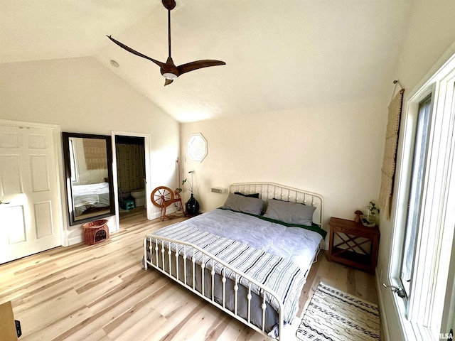 bedroom featuring vaulted ceiling, light hardwood / wood-style floors, and ceiling fan