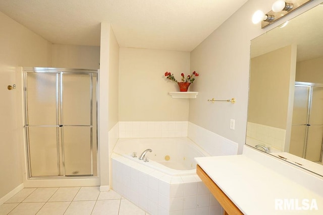 bathroom with tile patterned floors and shower with separate bathtub