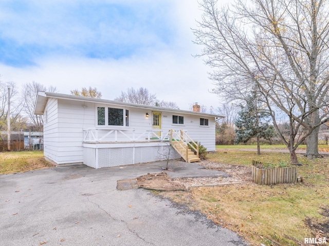 view of front of house with a wooden deck