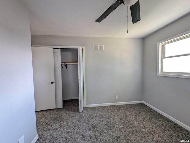 unfurnished bedroom featuring ceiling fan, carpet floors, and a closet