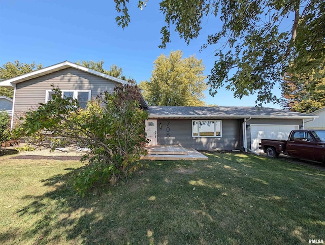 view of front of house with a garage, a front lawn, and a wooden deck