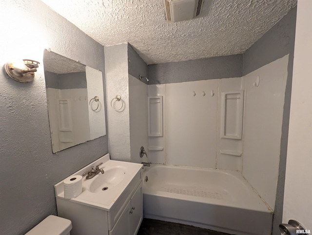 bathroom featuring shower / bathtub combination, visible vents, a textured wall, vanity, and a textured ceiling