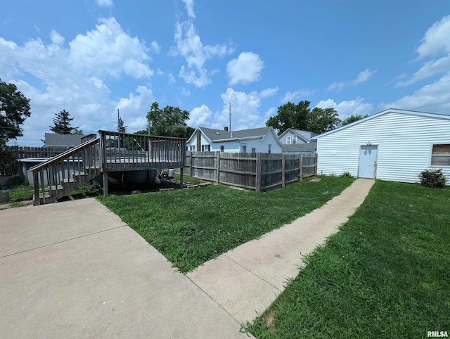 view of yard featuring fence and a wooden deck