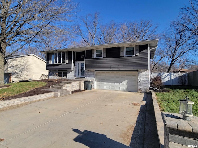 raised ranch featuring a garage