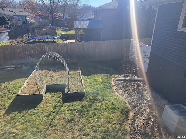 view of yard with a trampoline