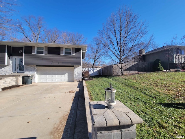 view of side of property with a garage and a yard