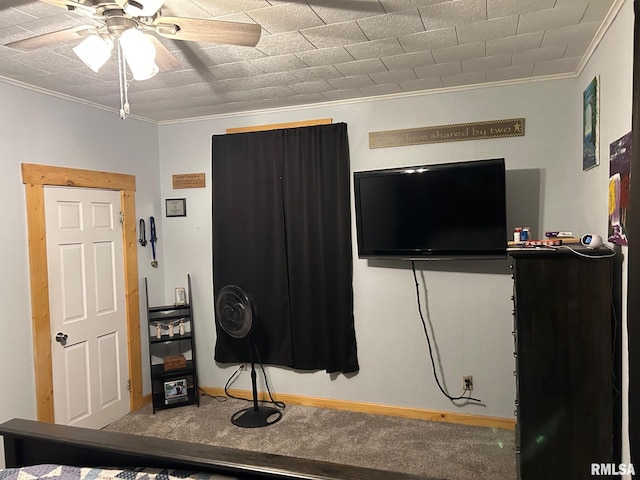 carpeted bedroom with ceiling fan and ornamental molding