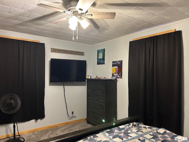 bedroom with ceiling fan and ornamental molding