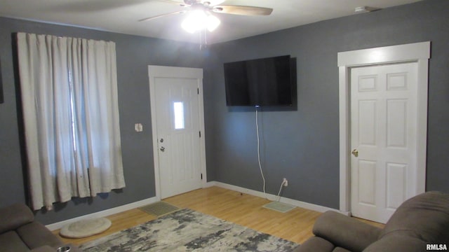 entrance foyer featuring ceiling fan and hardwood / wood-style flooring