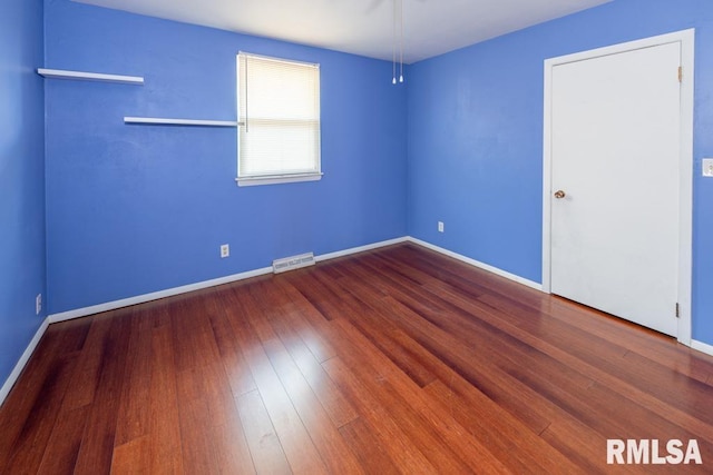 empty room featuring hardwood / wood-style floors