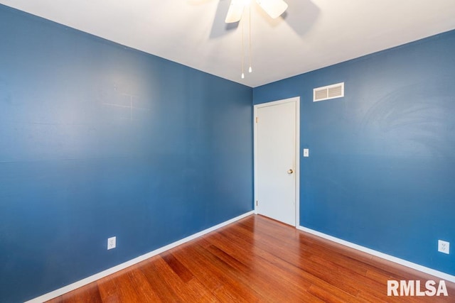 unfurnished room with ceiling fan and wood-type flooring