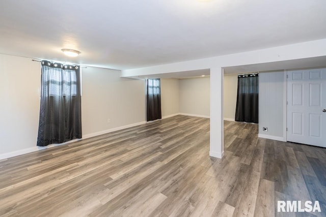 basement featuring wood-type flooring