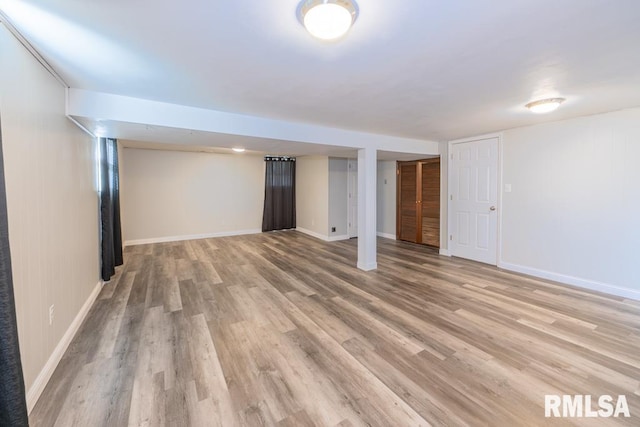 basement with light hardwood / wood-style floors