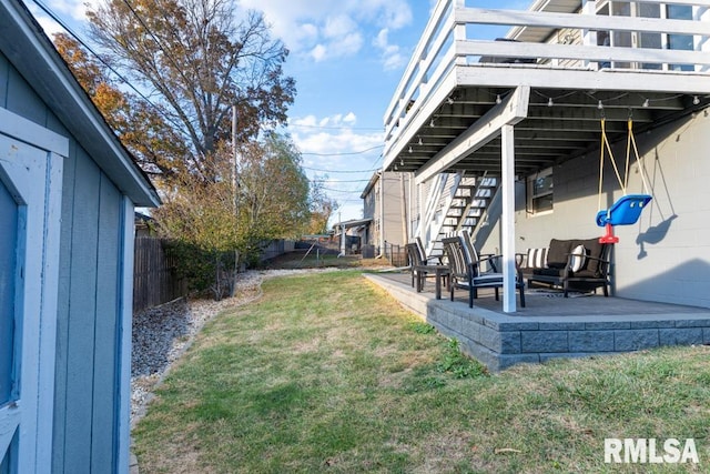 view of yard with a deck and a patio area