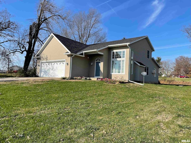 view of front of house featuring a garage and a front lawn