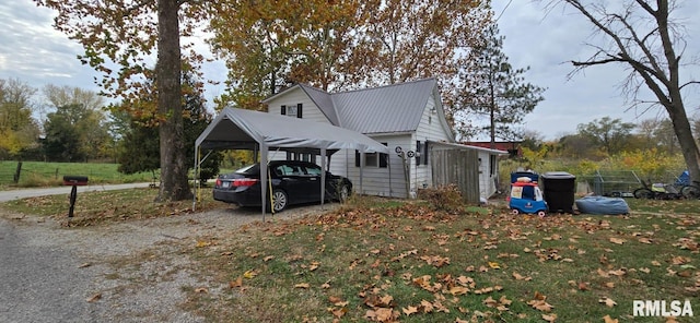 view of property exterior featuring a carport