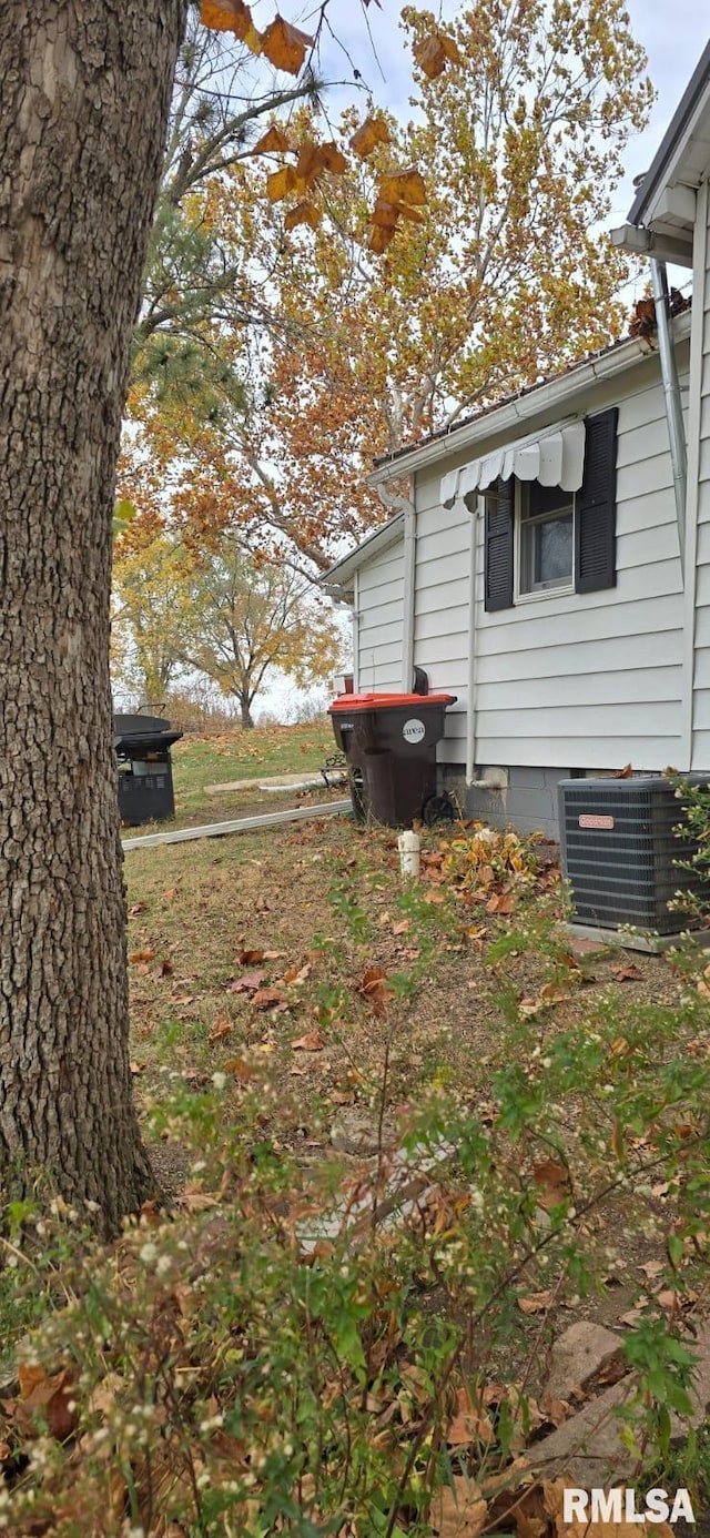 view of property exterior featuring central AC