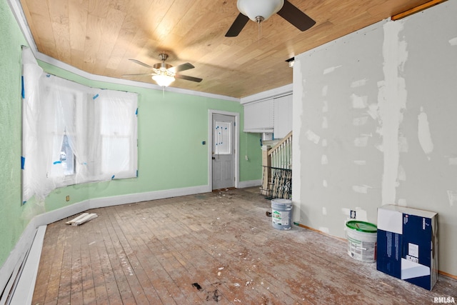 spare room with hardwood / wood-style flooring, ceiling fan, and wooden ceiling