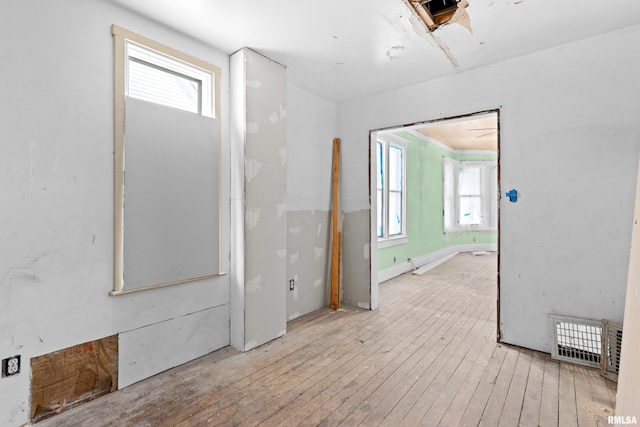 empty room with light hardwood / wood-style flooring