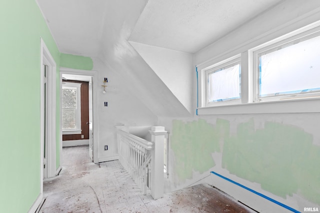 staircase featuring vaulted ceiling