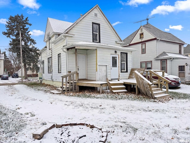 view of snow covered house