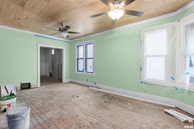 empty room featuring ceiling fan, light hardwood / wood-style flooring, and wooden ceiling