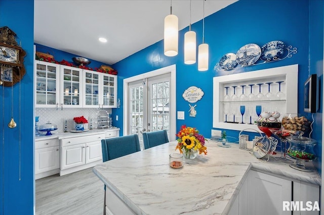 dining space with light hardwood / wood-style floors