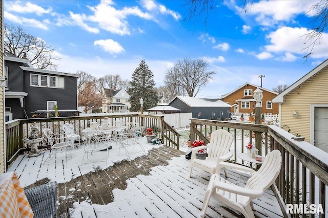 view of snow covered deck