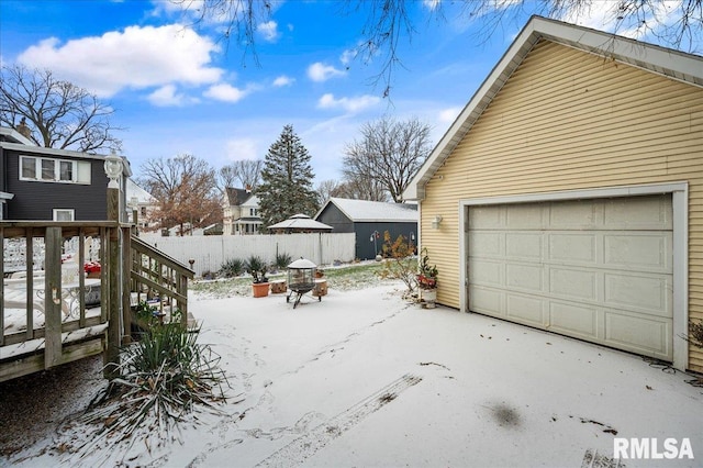 view of snow covered garage