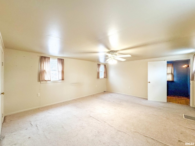 carpeted empty room with ceiling fan