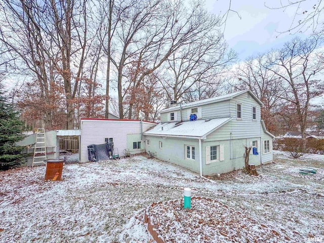 view of snow covered house