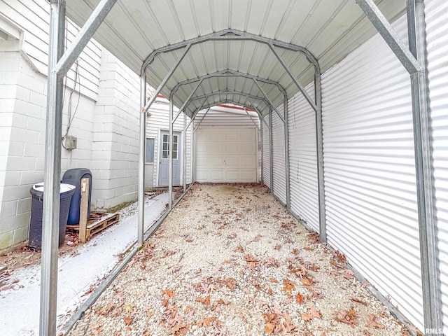 view of vehicle parking featuring a carport