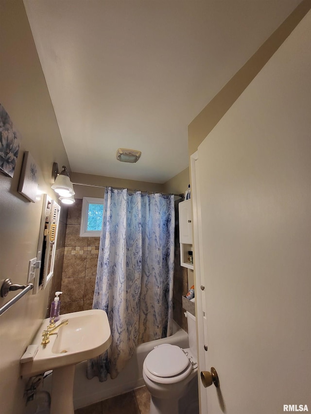 bathroom featuring tile patterned flooring, shower / bathtub combination with curtain, and toilet