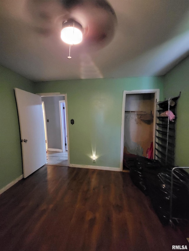 unfurnished bedroom with wood-type flooring and a closet