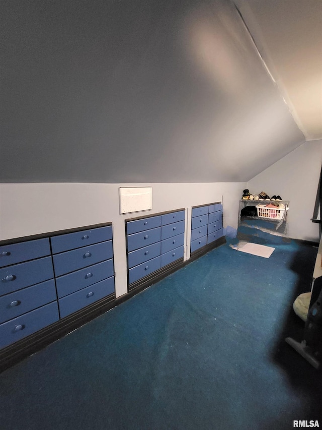 bonus room featuring carpet flooring and vaulted ceiling