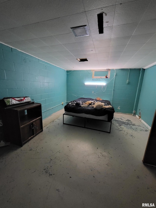 unfurnished bedroom featuring concrete flooring