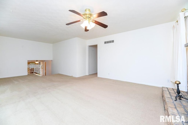 unfurnished living room featuring carpet and ceiling fan