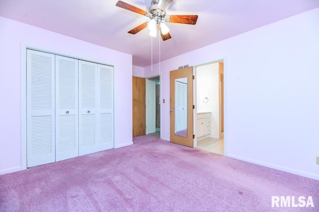 unfurnished bedroom featuring light carpet, ensuite bathroom, and ceiling fan