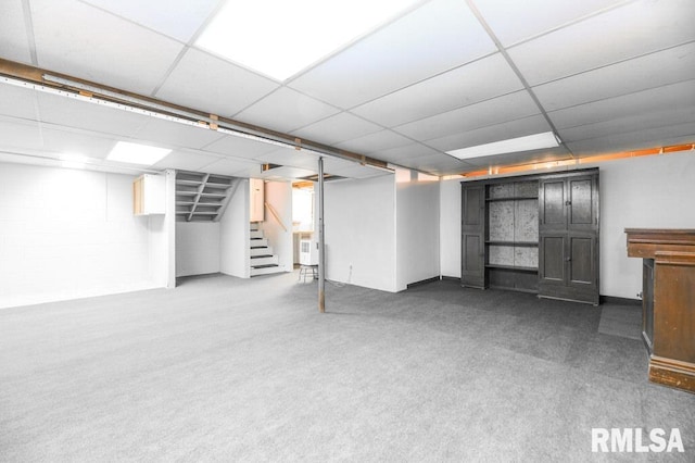 basement featuring dark colored carpet