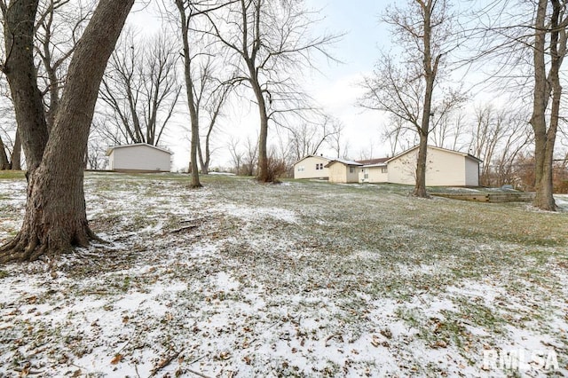 view of yard layered in snow